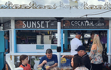Sunset garden bar on the Palace Pier of Brighton Beach